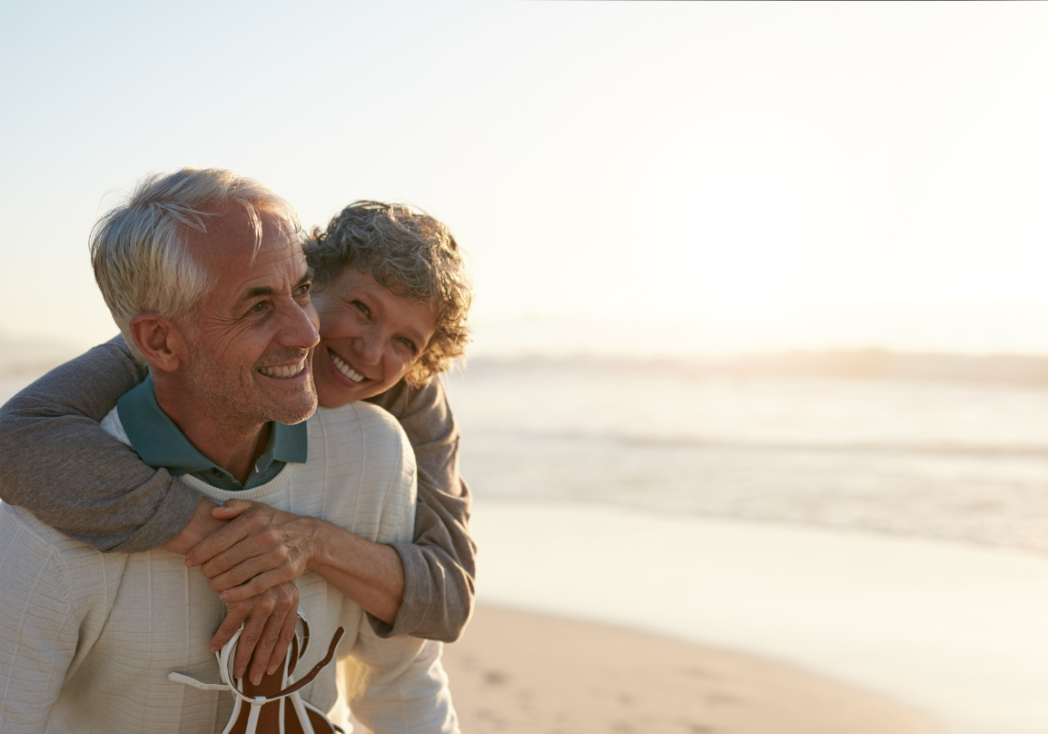 A retired couple talking together at home